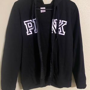 Pink hooded zip up sweatshirt.